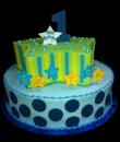 1st Superstar Birthday cake,  Blue and green Buttercream iced,   round 2 tier decorated with star shaped cake top, stripes, stars, dots and blue pearls.   Everything on this cake is EDIBLE.   (Serves 50-80 party slices)