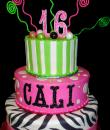 zebra and striped 16th Birthday cake,  White and pink Buttercream iced, 3 round tiers decorated with green stripes, zebra stripes, dots, gumballs, ribbon and bow,  everything on this cake is EDIBLE except the plastic swirl swizzles. (Serves  48-135 party slices)