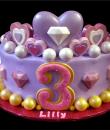 Diamond and Hearts 3rd Birthday Cake. Purple buttercream iced, round, decorated with hearts, diamonds and pearls. Everything on this cake is EDIBLE. (Serves 8-80 party slices)