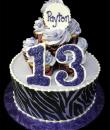 Lavender Zebra Cupcake 13th Birthday cake,  Lavender buttercream iced,  round decorated with an edible zebra print, cupcakes and pearls.  Everything on this cake is EDIBLE.  (Serves 8-80 party slices)