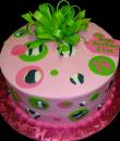 Zebra Dots 14th Birthday Cake. Pink buttercream iced, round, decorated with pink, green and zebra dots, topped with a big green bow. Everything on this cake is edible. (Serves 8-80 party slices) 
