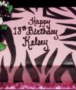 Pink Zebra 18th Birthday Cake. Pink buttercream iced, sheet cake decorated with zebra stripes and black and white roses. Everything on this cake is edible. (Serves 24-98 party slices.) 